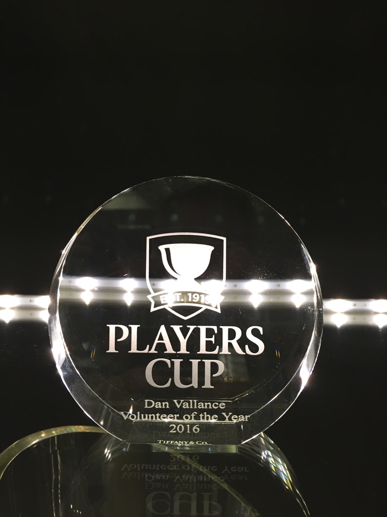 Crystal circle hand engraved with Player Cup logo