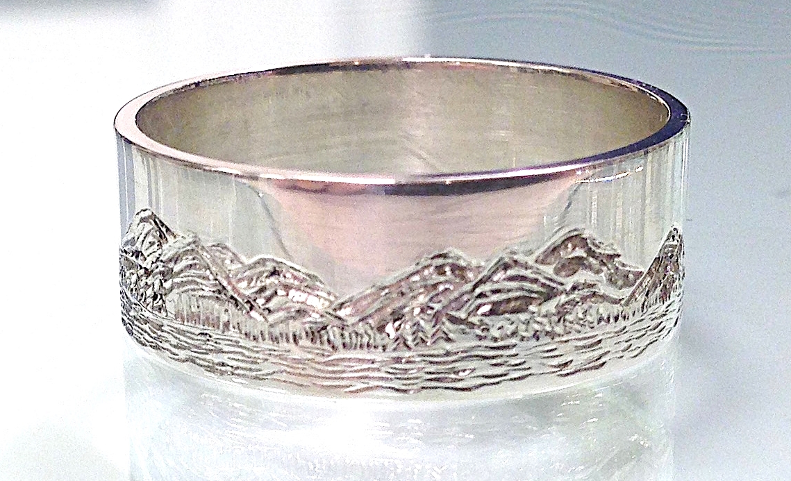 hand engraved ring with mountain scene 