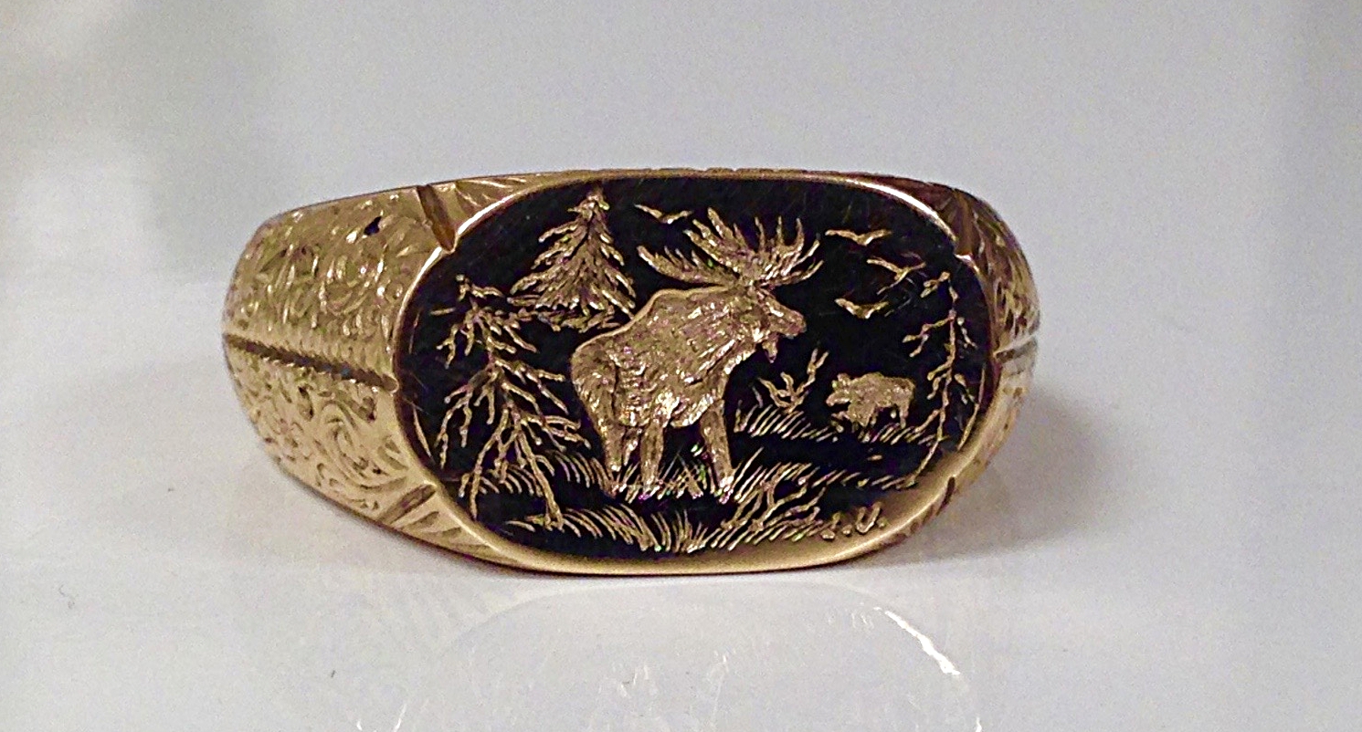 custom hand engraved ring with moose design 