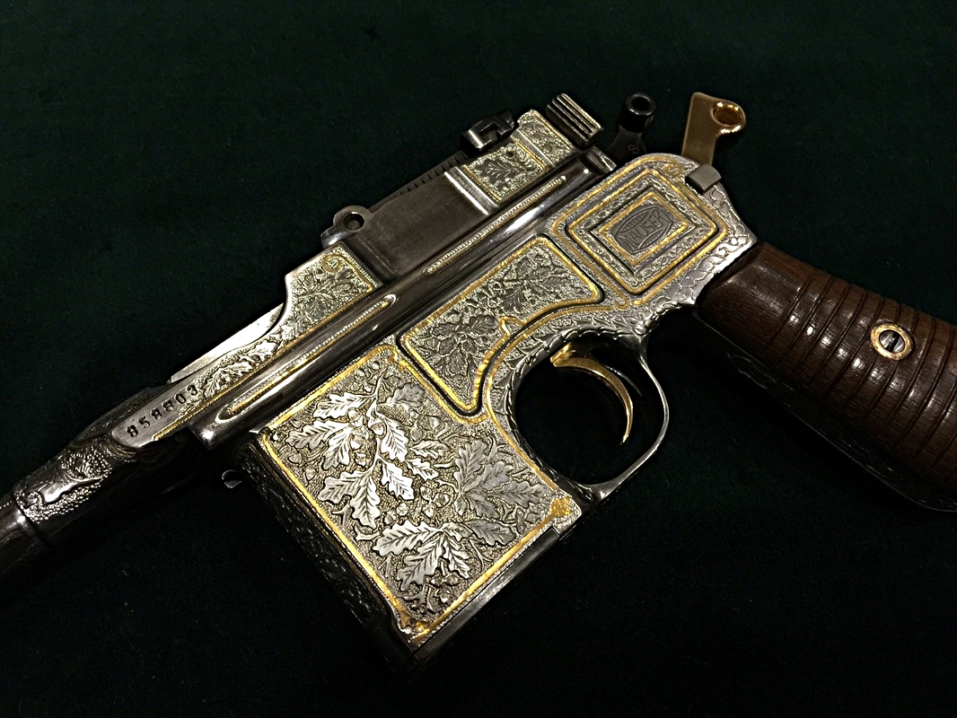 custom hand engraved pistol with acorn design 