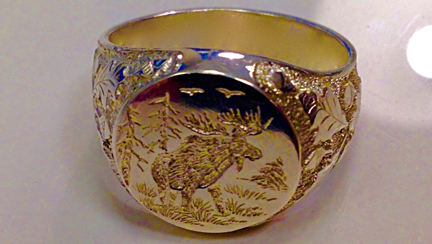 custom hand engraved ring with moose design and acorn