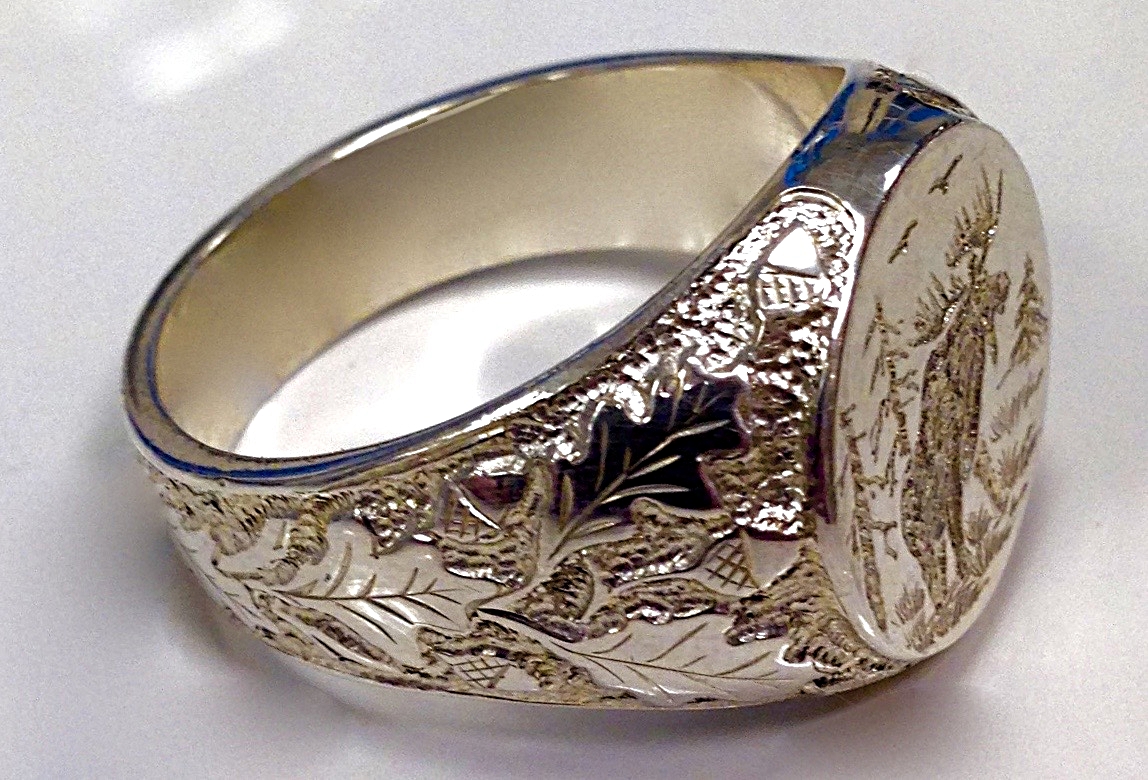 custom hand engraved ring with moose design and acorn