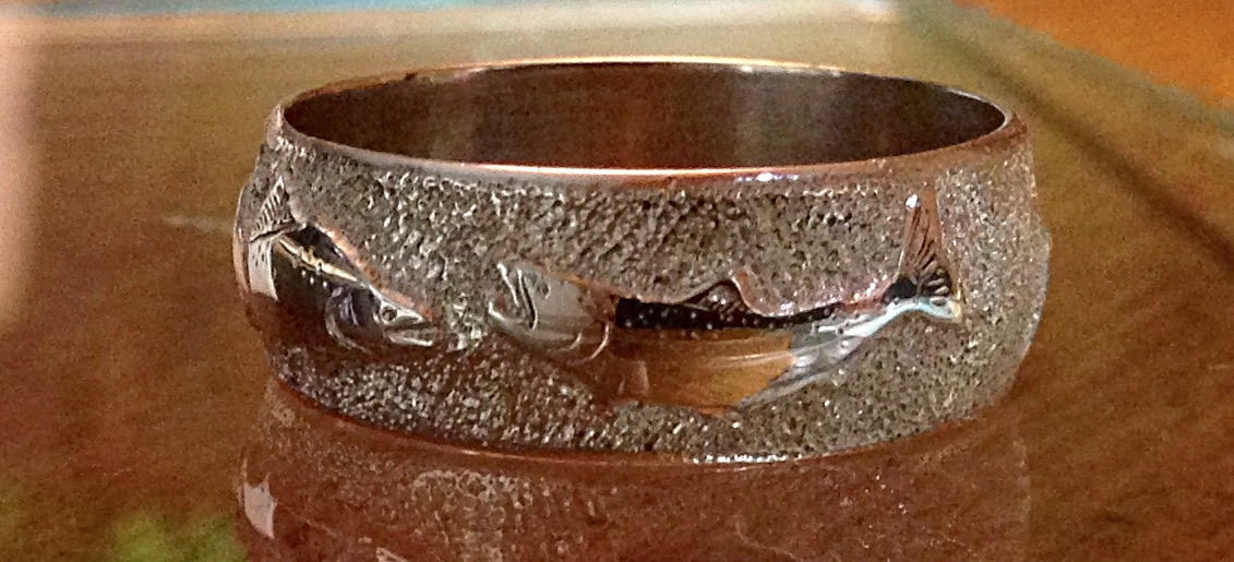 hand engraved ring with wild salmon