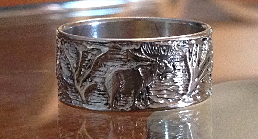 hand engraved gold ring with mountain scene and elk