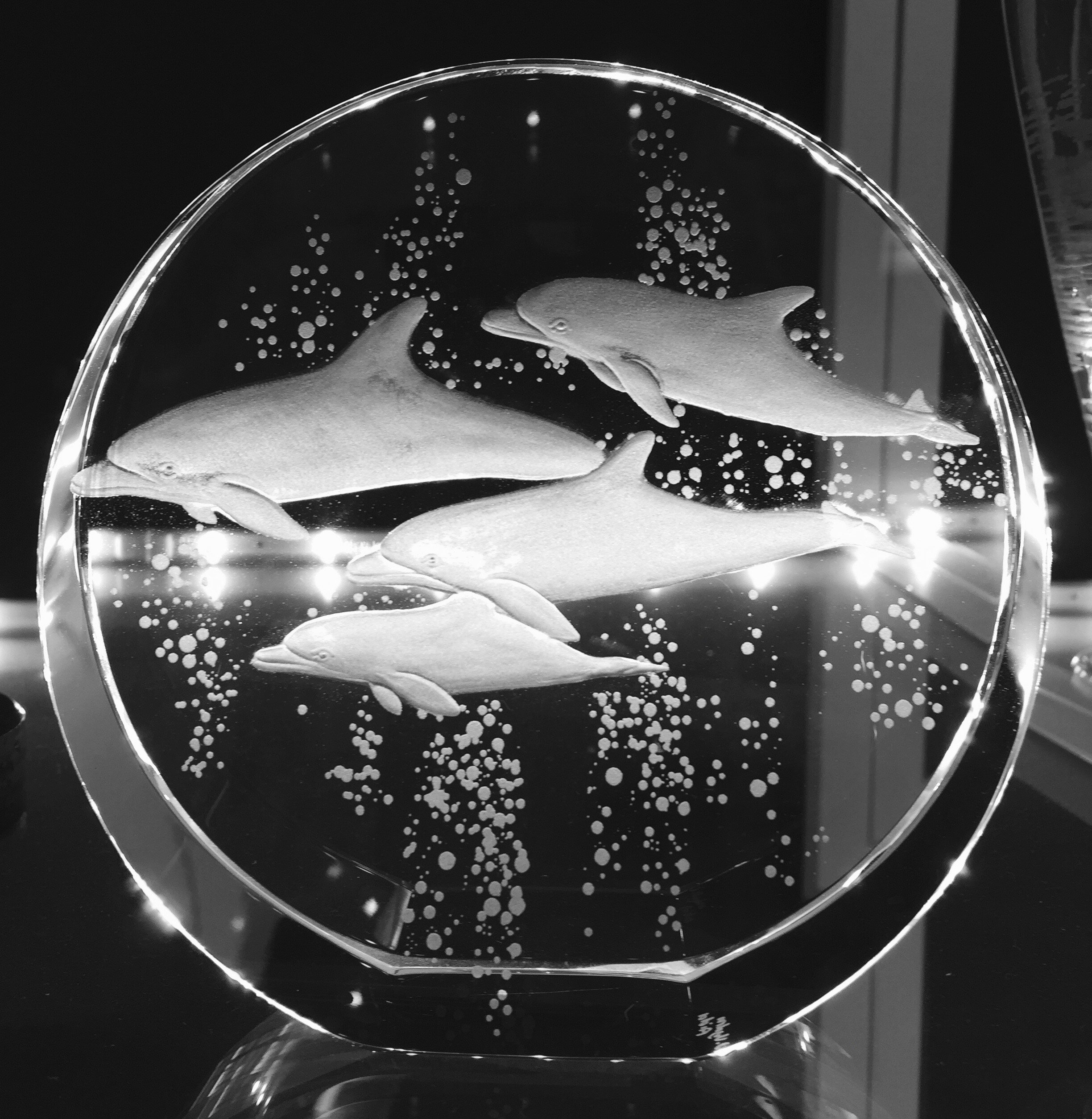 crystal sculpture hand engraved with dolphins