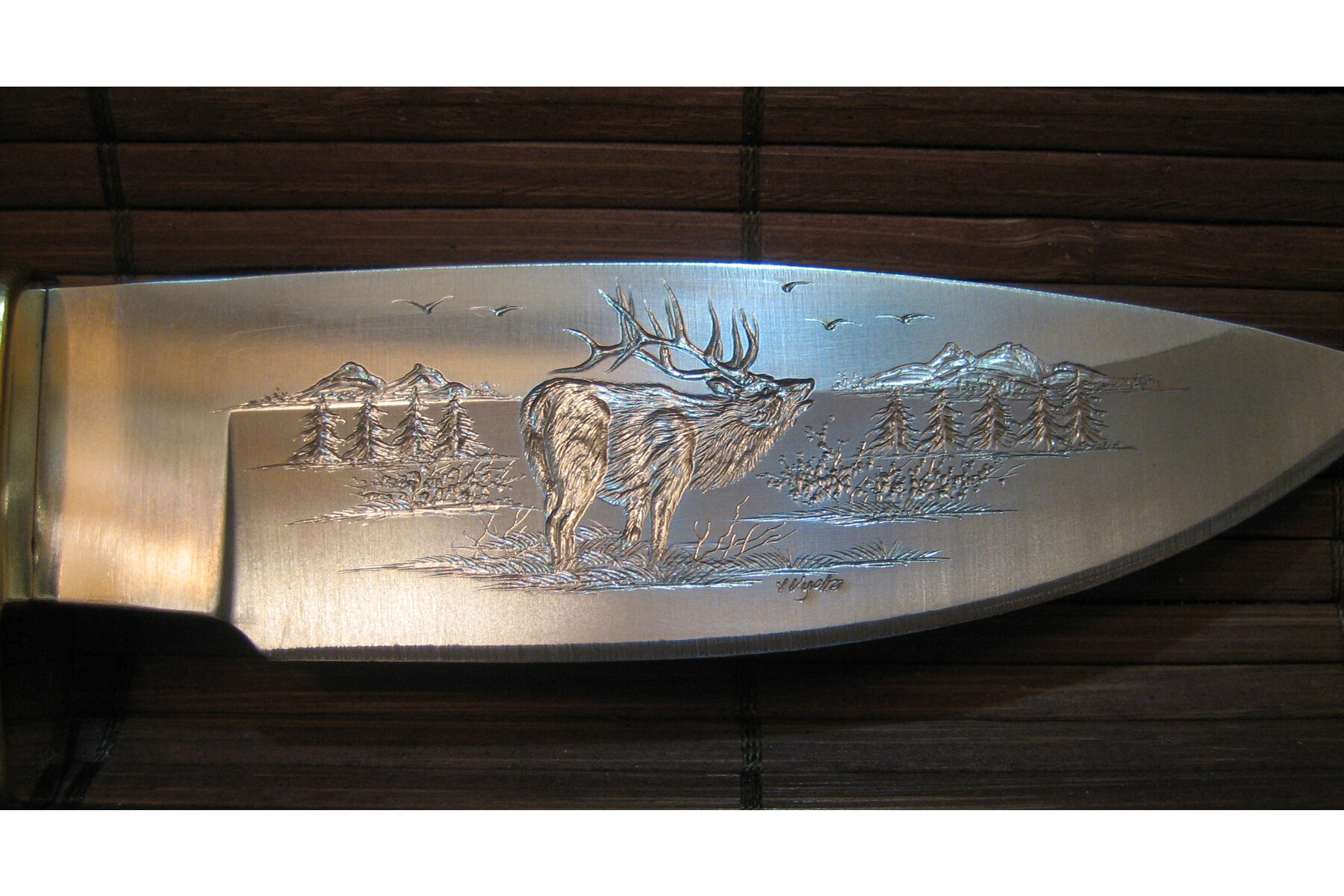 custom unique hand engraved knife with moose and elk and mountain scene 