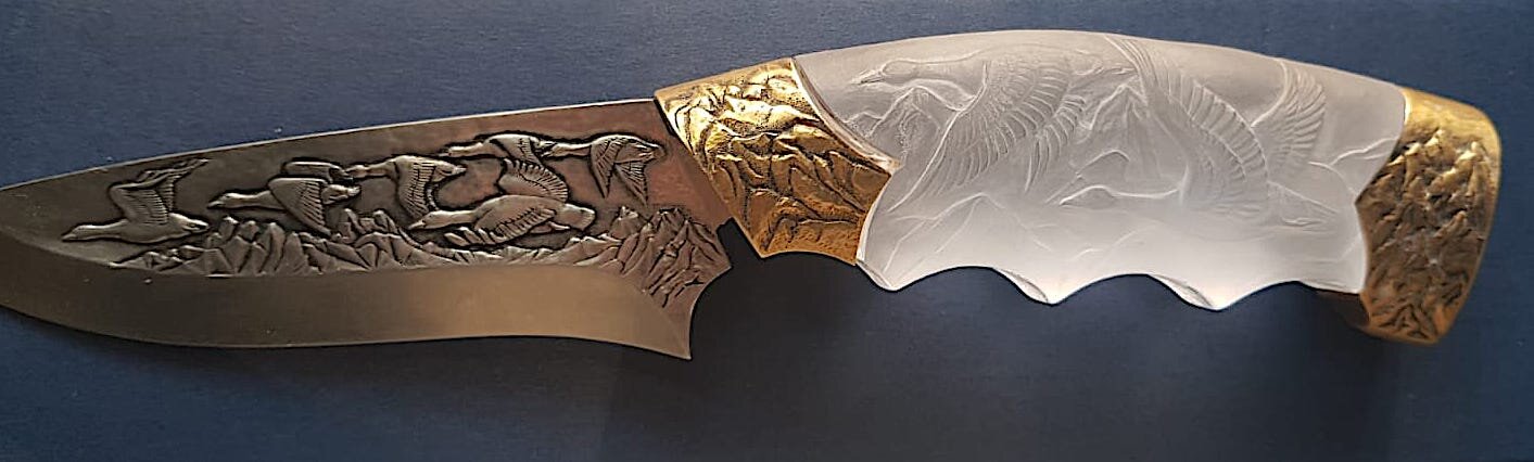 knive hand engraved blade and handle combination of brass and crystal hand engraved with geese and mountains side 1.jpg