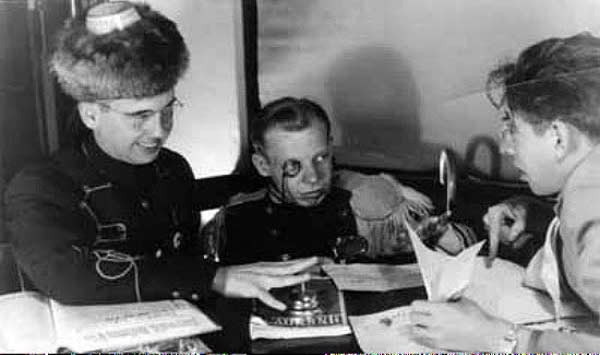 Yep, this is Robert Bloch, Raymond Palmer, and Louie Samplner. No idea why the Russian/Prussian get-ups, but hey! Cool pic!