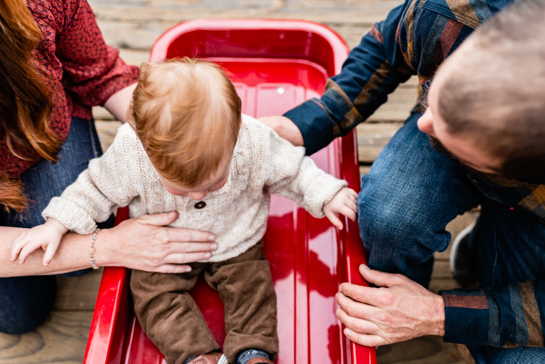 Family lifestyle with wagon on bridge at Hap Magee Park.