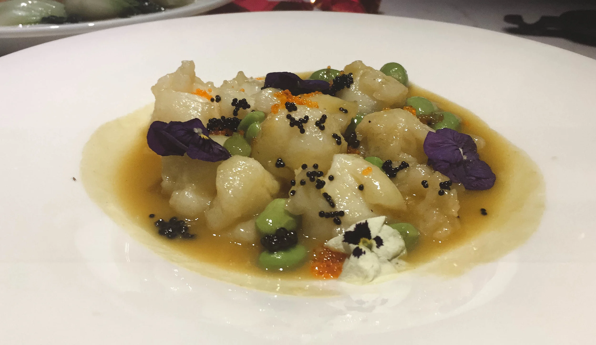 Wok fry native lobster in superior stock - with edamame and caviar