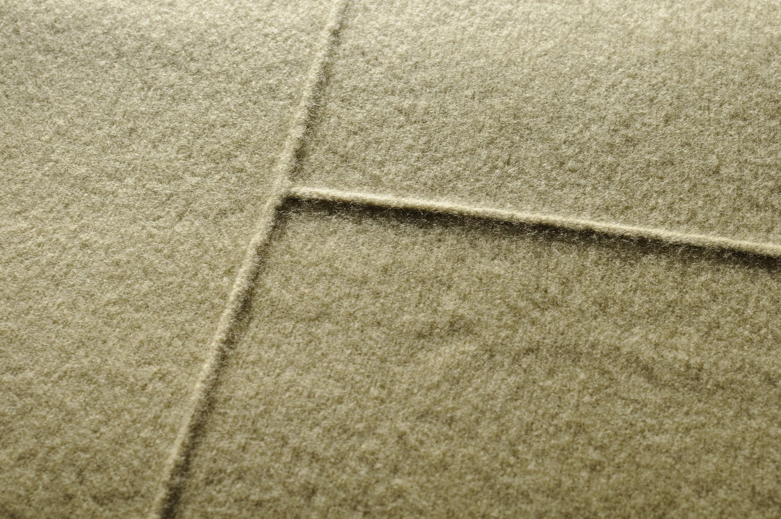 Close-up of ON-TONE throw detailing.