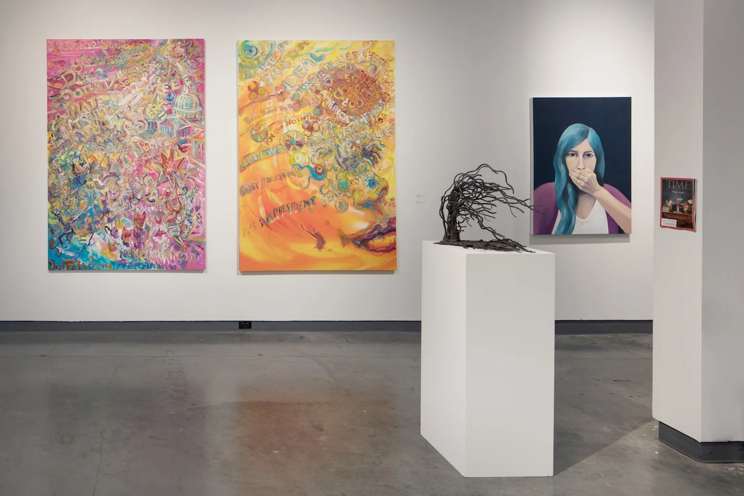 From the State of the Union side, from left to right, two large canvases by Ken Mabrey, a sculpture by Anne Oldach and a painting by Lauren Peters
