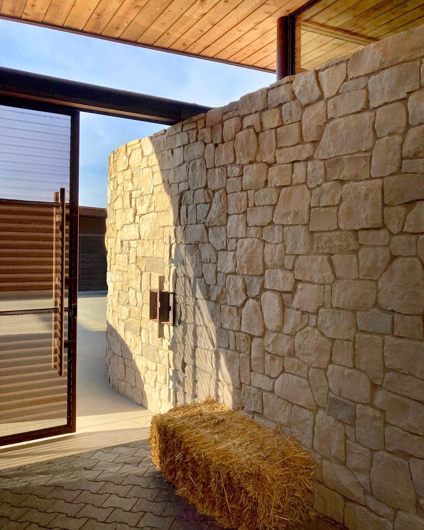 Sunlight bathes the warm limestone&nbsp;and perforated&nbsp;weathered steel within the stable at our #MCT_IslandEquestrian estate. The 5-acre estate, located on Mercer Island,&nbsp;features a stable, arena, caretaker&rsquo;s residence, and workshop a