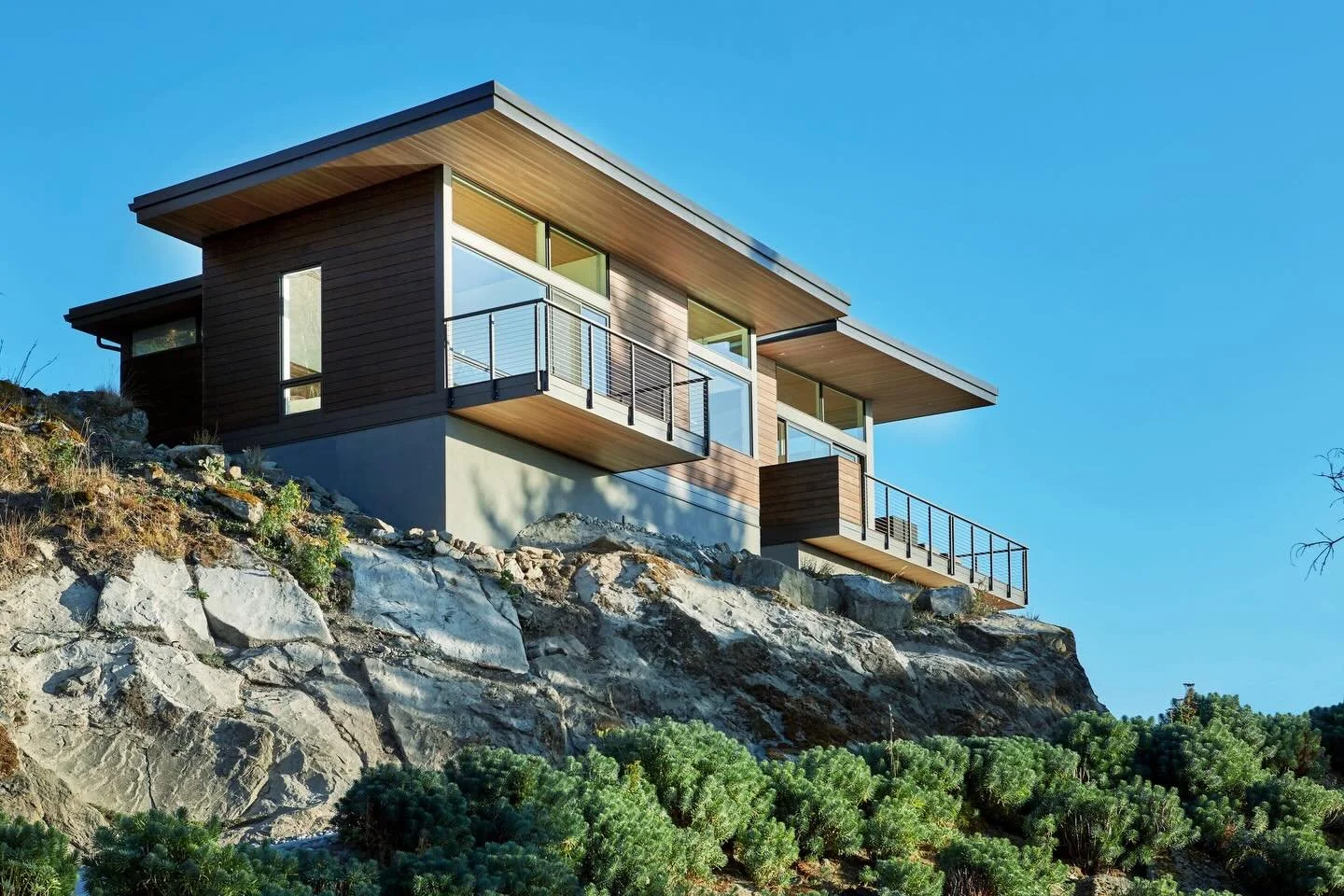 Set atop a rocky hillside, the existing landscape at our #MCT_EyrieHouse presented the perfect opportunity to integrate the beautiful massive boulders into the home&rsquo;s foundational structure. Designed to delicately rest upon the rockface and str