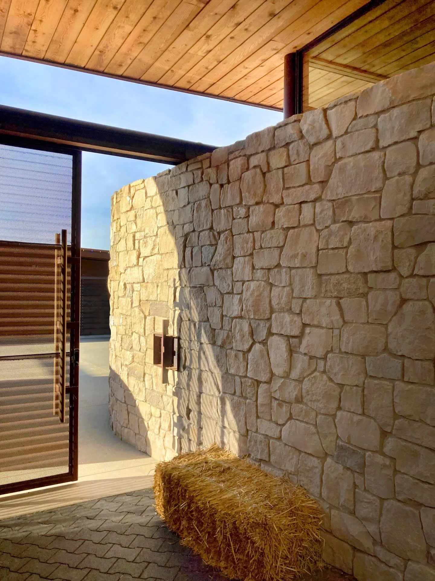 Warm limestone and perforated weathered steel become striking features throughout our #MCT_IslandEquestrian stables, especially when bathed by seasonal sunlight, further enhancing the beautiful textural movement of these specialty finishes. Located o