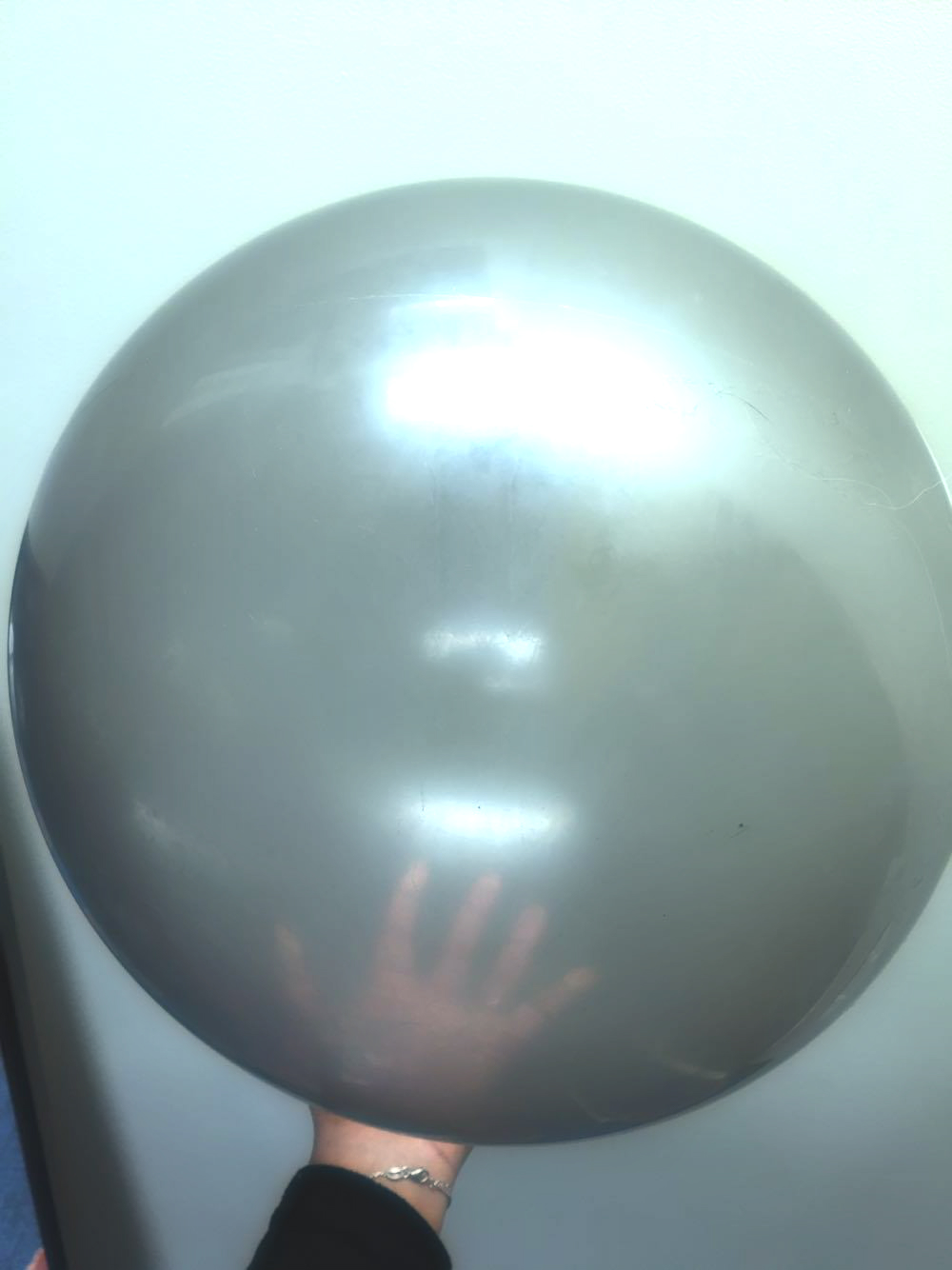 I use a nice large ball. It helps for toddlers still developing their coordination and gross motor skills. Some kids can roll easily, others are still learning.