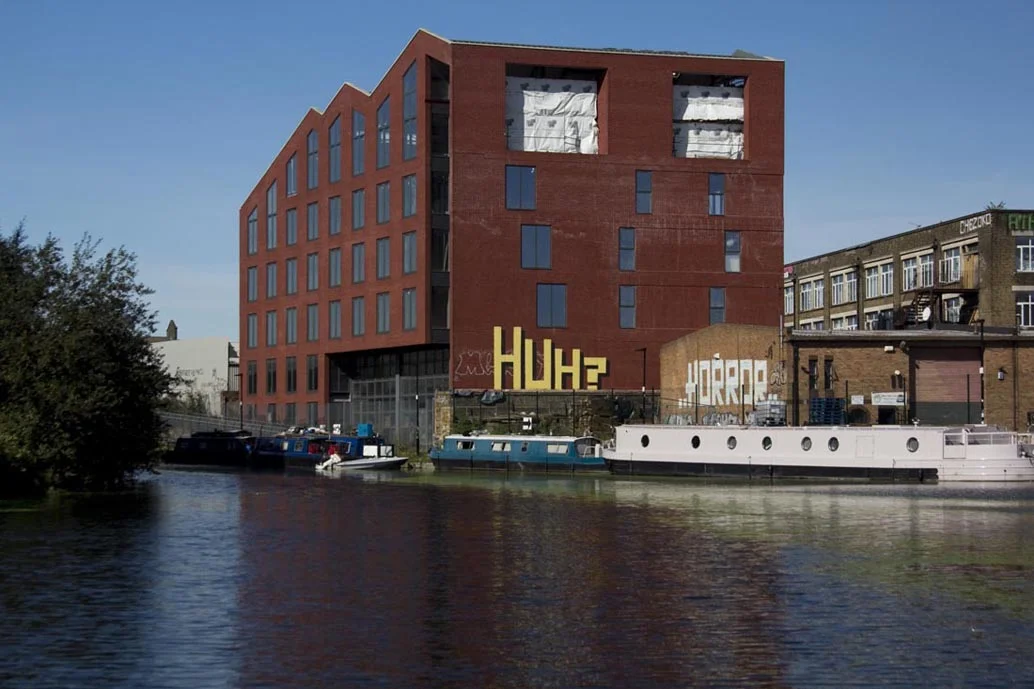 The phrase HUH? placed with no meaning or context provokes its definition within the viewer.