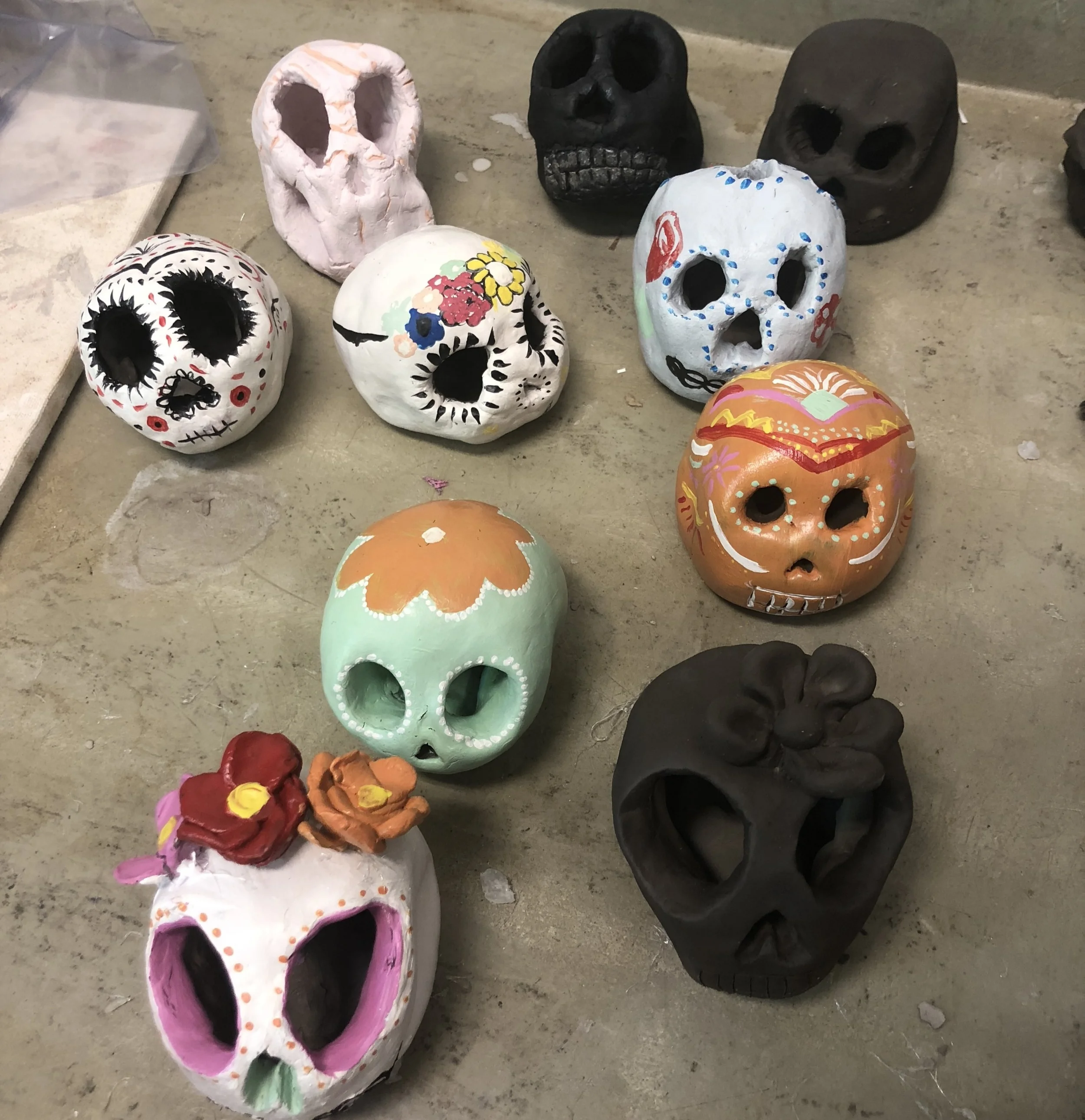 Middle schoolers continue their work on clay calaveras in open studio this week for Dia de Los Muertos. Featured work of: Julian, Plum, Harriet, Auden, Josie, Sasha, Mahlete, Mia, and Ava.
