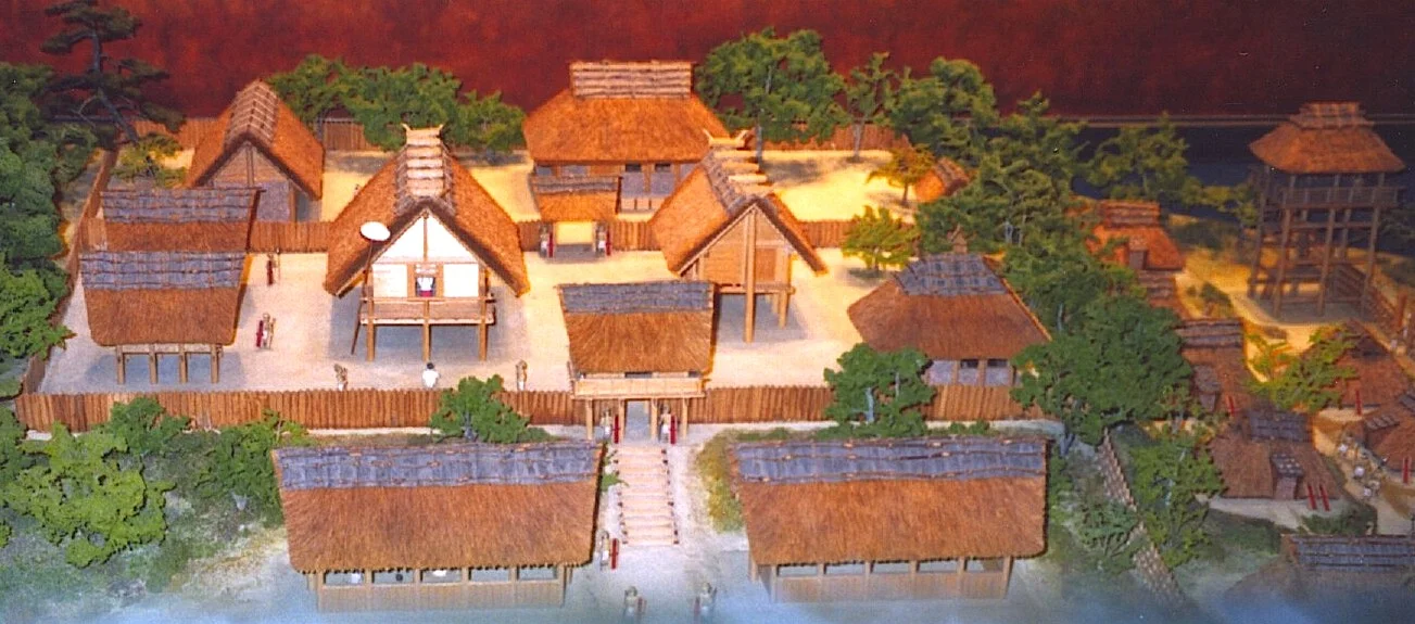 2-1 Reconstruction of a Yayoi Period (300 BCE or earlier - 300 CE) village at the Osaka Prefectural Museum of Yayoi Culture. The building with the light front may have been an early shrine.
