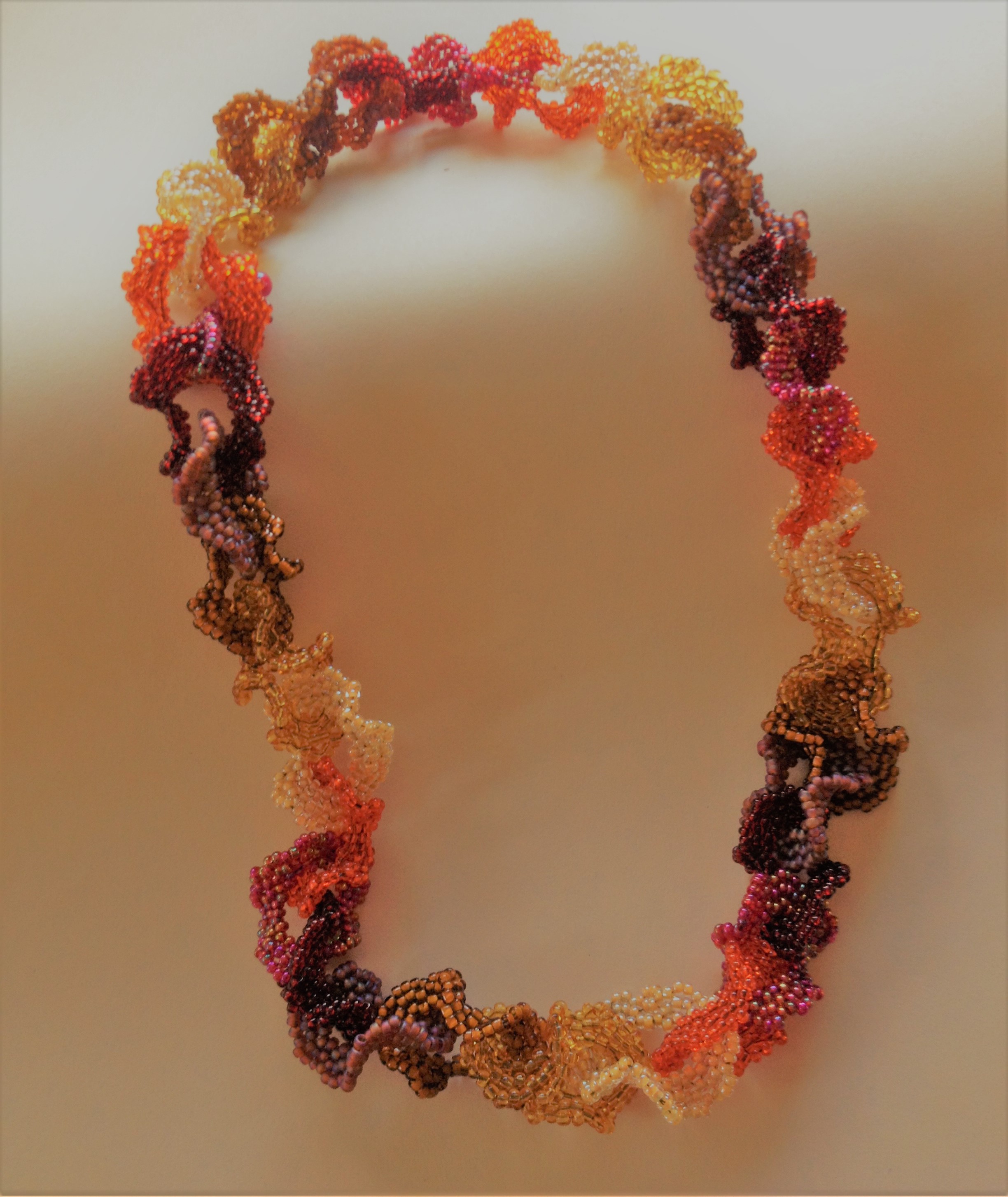 CAROL NEWMEYER Falling leaves necklace 18" Glass Beads $100.00