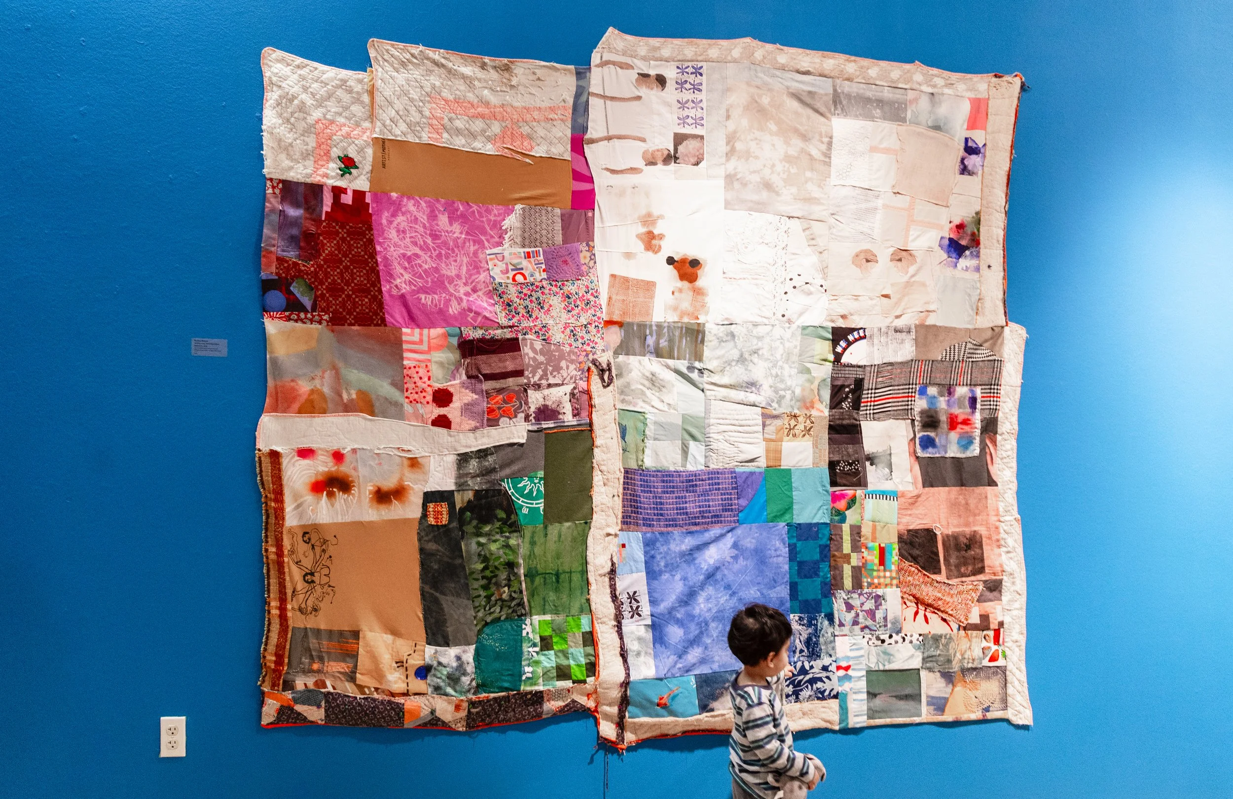 Interwoven, Interdependent, Interweb Hand pieced studio scraps from 48 participating artists, vintage quilt scraps, Approx 7ft by 7ft, 2024