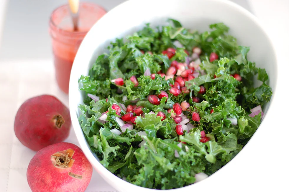 Raw Kale Salad with Pomegranate & Pumpkin Sees