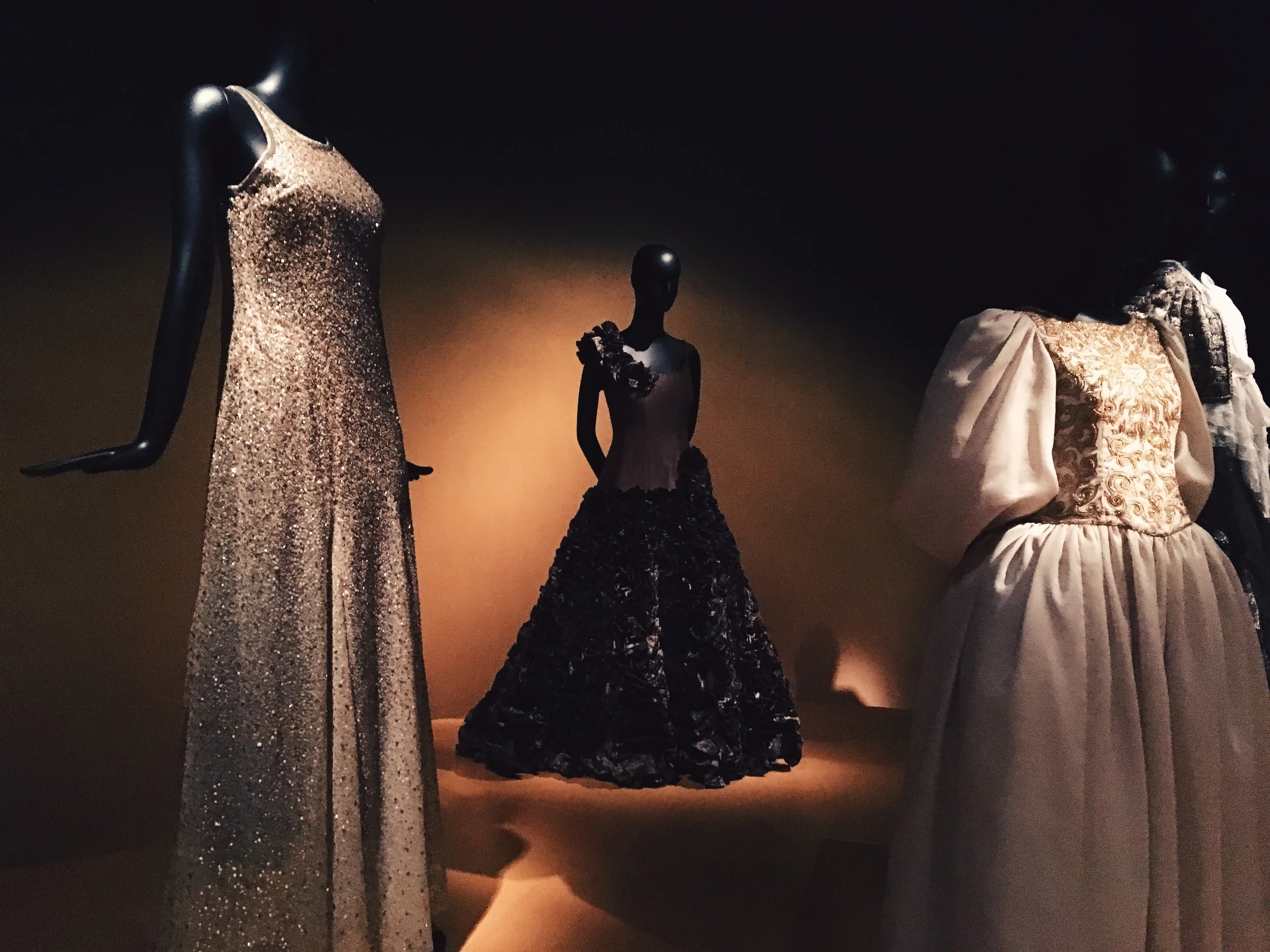  The silver sequined gown on the left was worn by former First Lady Laura Bush 