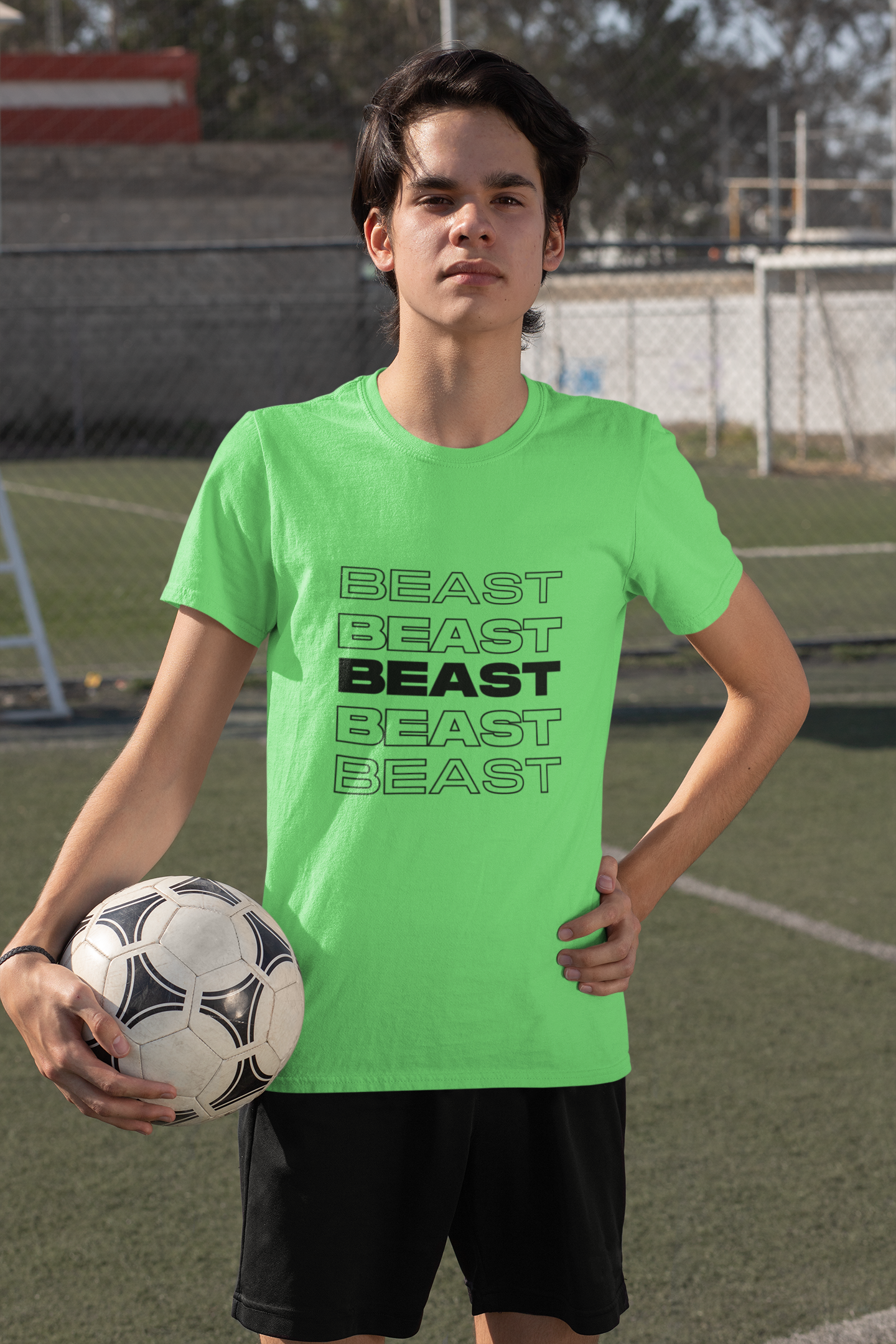 t-shirt-mockup-featuring-a-serious-teenage-boy-holding-a-soccer-ball-33569.png