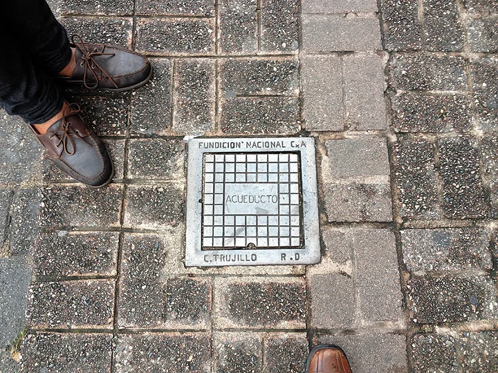 A street utility plate from the 1960s indicating "Ciudad Trujillo", when the dictator renamed the city after himself.