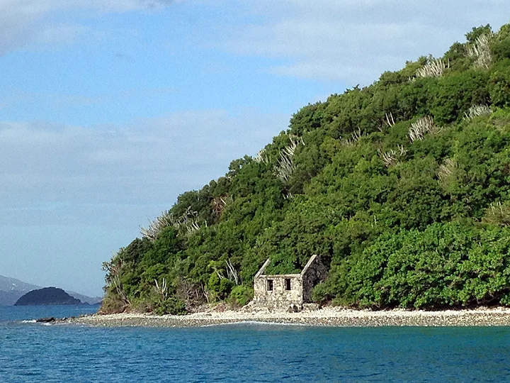 Bye bye USVI!  Motoring past the ruins of a customs house on the shore of Whistling Cay, St. John.