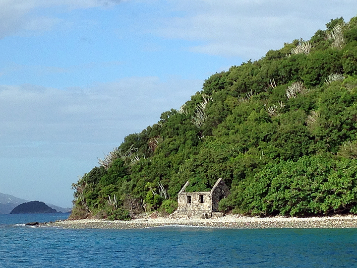 Bye bye USVI! Motoring past the ruins of a customs house on the shore of Whistling Cay, St. John.