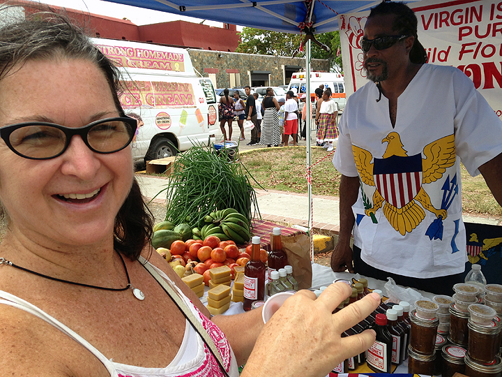 Deb samples the honey.