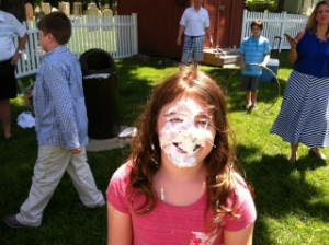 One of our kids enjoying the pie throw at our church picnic.