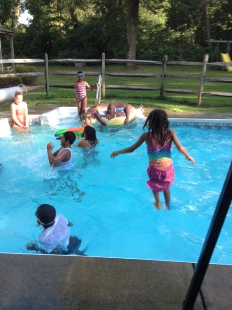 Participants in the Five Days with Mom program take a break on a hot summer afternoon.