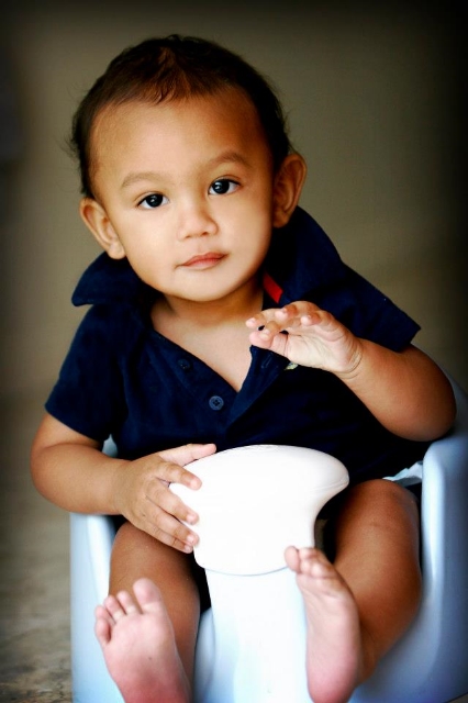 "Hunter Zen 9 months old. Content. Chillin'. Beating on his lil' drum to any lil' beat he could find" / Photo Courtesy Lenore Davis