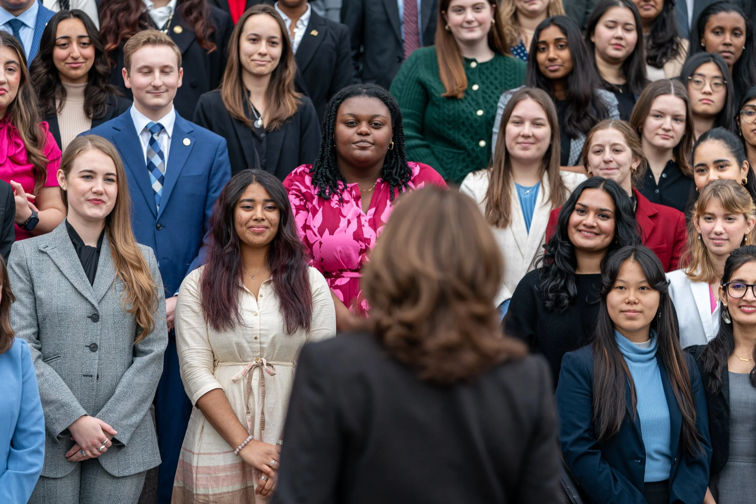 Vice President Kamala Harris speaks before posing for a photo with the Fall 2024 class of White House interns, Wednesday, December 18, 2024, on the Navy Steps of the Eisenhower Executive Office Building at the White House. (Official White House Phot