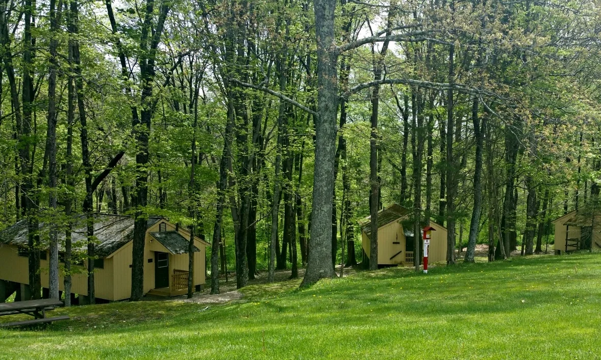 Camper Cabins - Rustic but comfortable camper cabins with electricity and half bath. Newly constructed bath house is a short walk from cabins.
