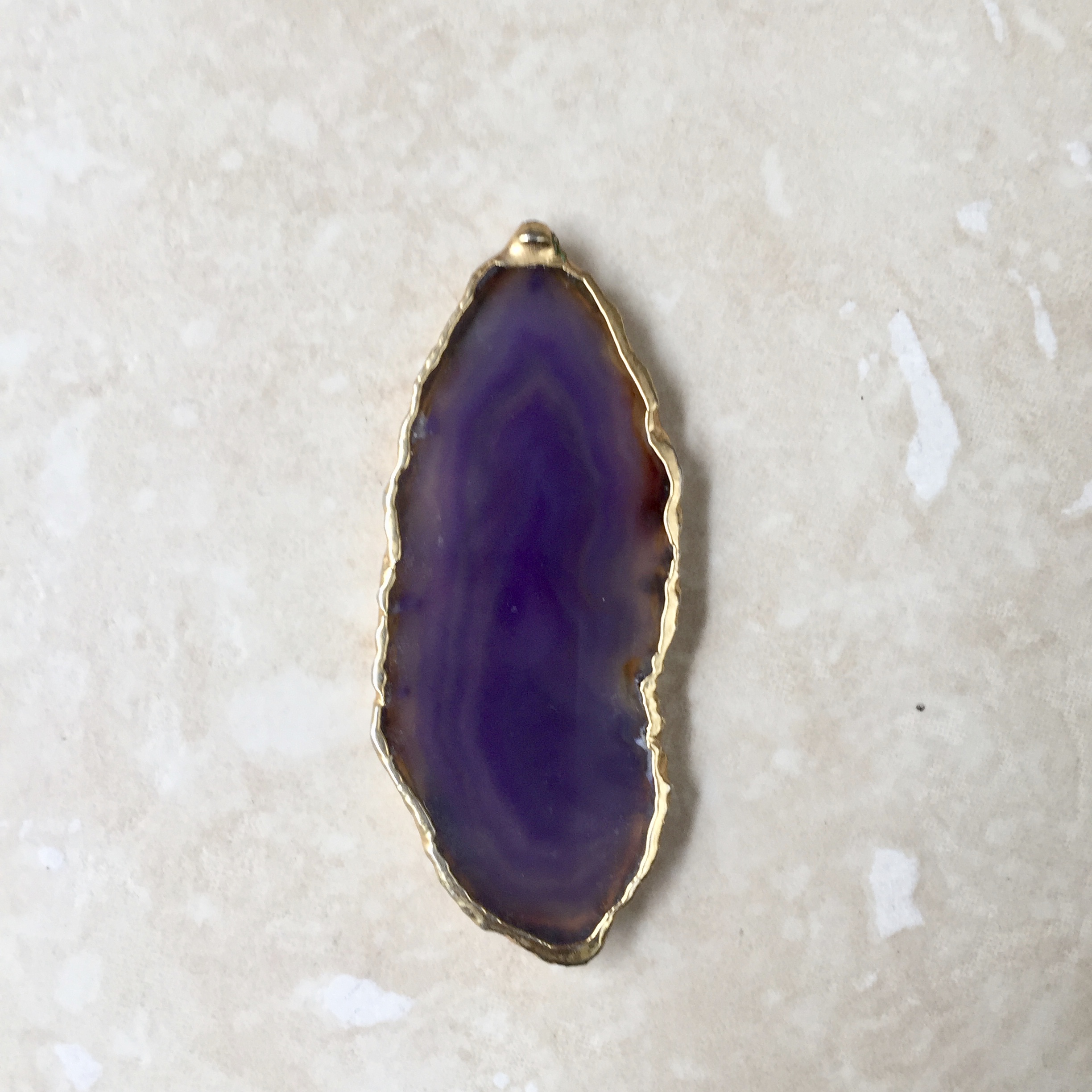 Dyed agate with edges painted in gold