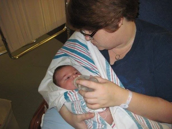 Baby J being bottle-fed Holly's expressed milk in the NICU. First feeding after his chest tube was removed.