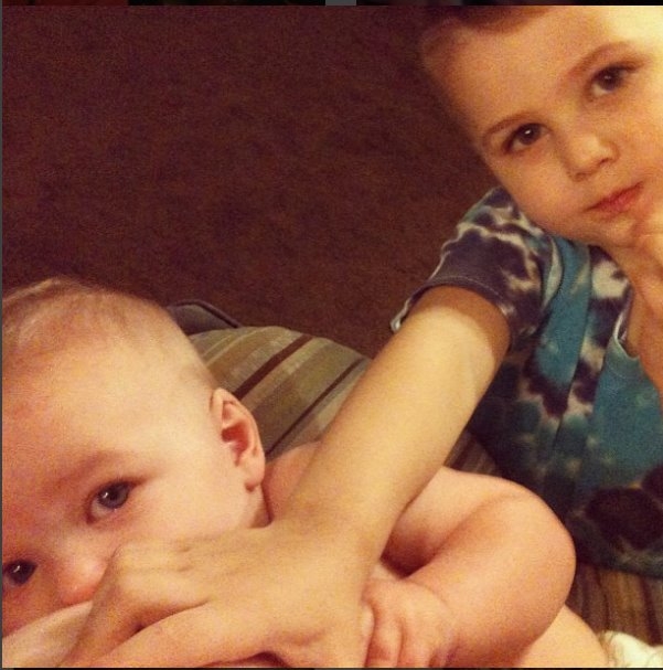 Baby C breastfeeding at 7 months as Big Brother J "helps"