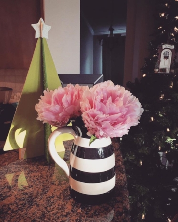 A fun and unexpected combo: spring blooms and Christmas decorations