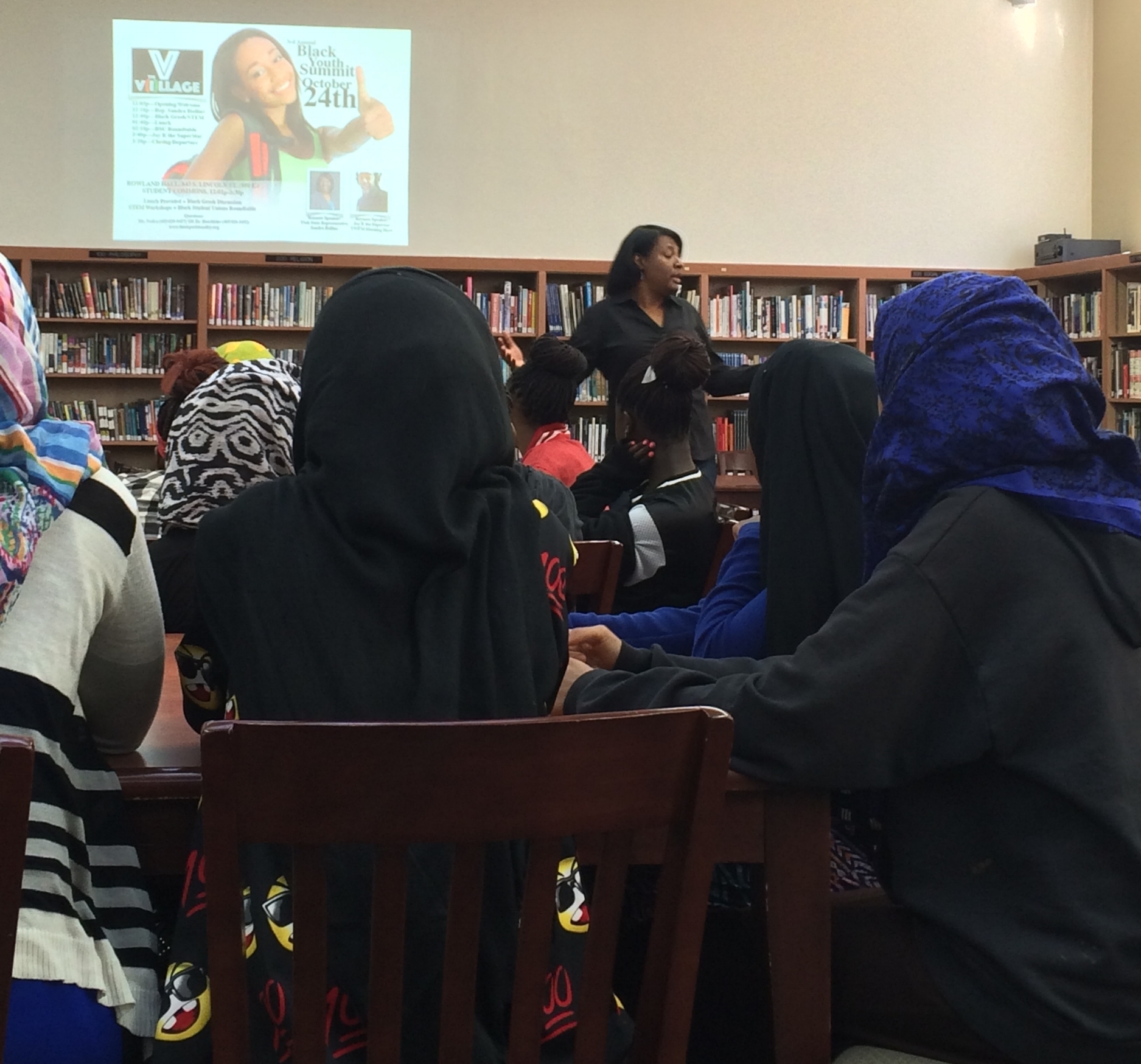 Utah Rep. Sandra Hollins discussing political, communal empowerment with participants of the 3rd Annual Black Youth Summit (2015) hosted by The V(i)llage ™ at Rowland Hall.