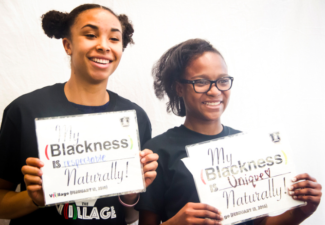 Two attendees from West High School and Hawthorne Academy represent their "Black" expression at Medicine U (2016).