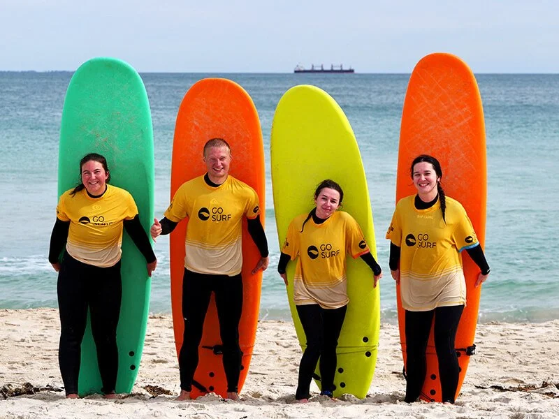 * Group of first-time surfers learning basics in Perth WA
