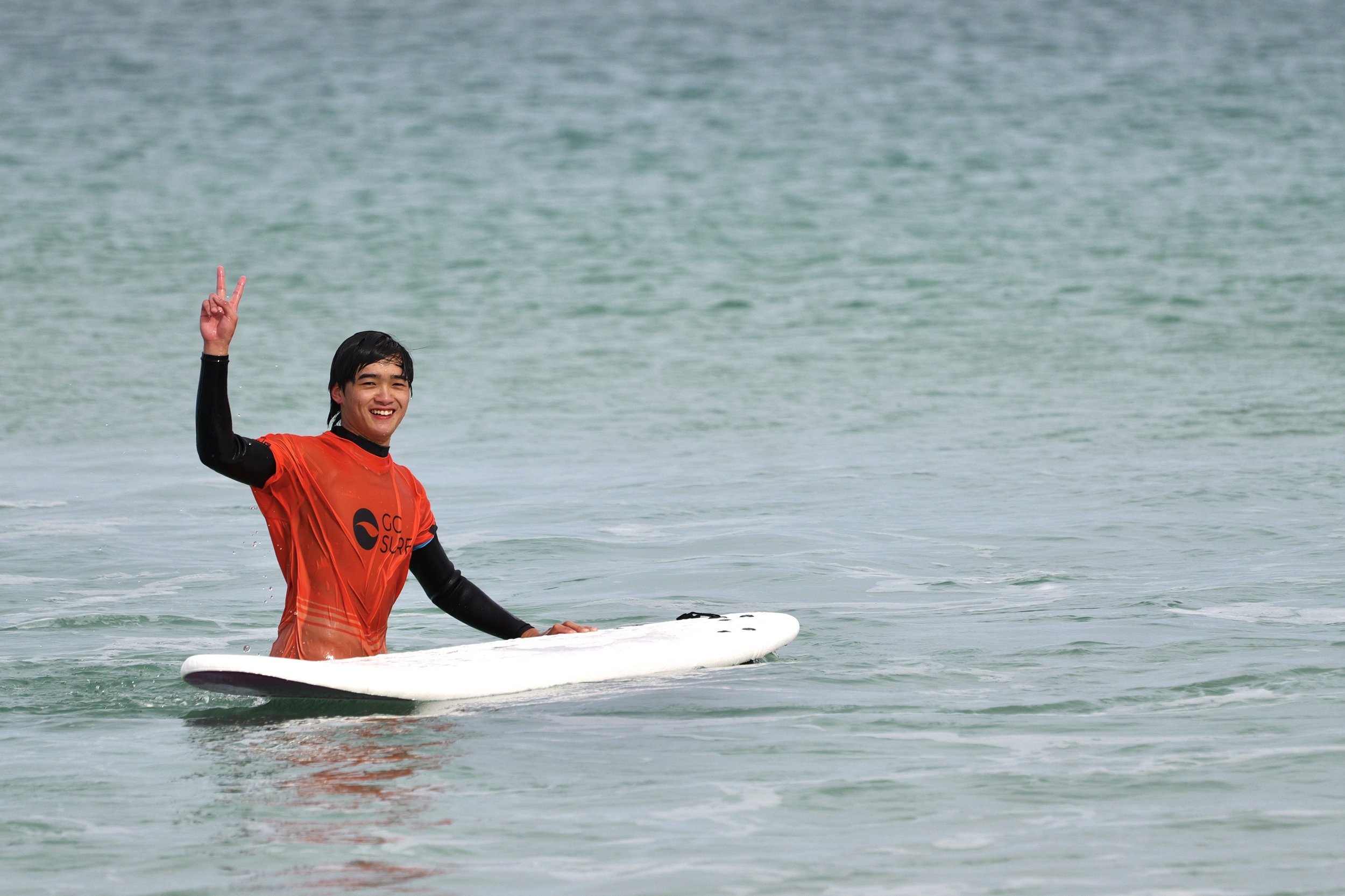 Go Surf Perth student smiling at the camera after riding a wave
