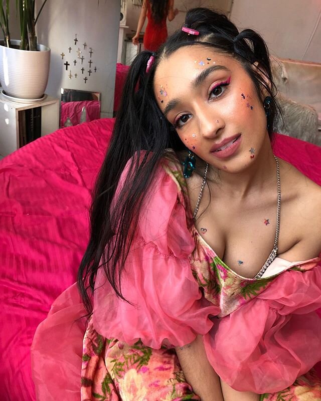 a 90&rsquo;s dream 🦄💕 one of the many looks for the &ldquo;Headaches&rdquo; video @raveena_aurora