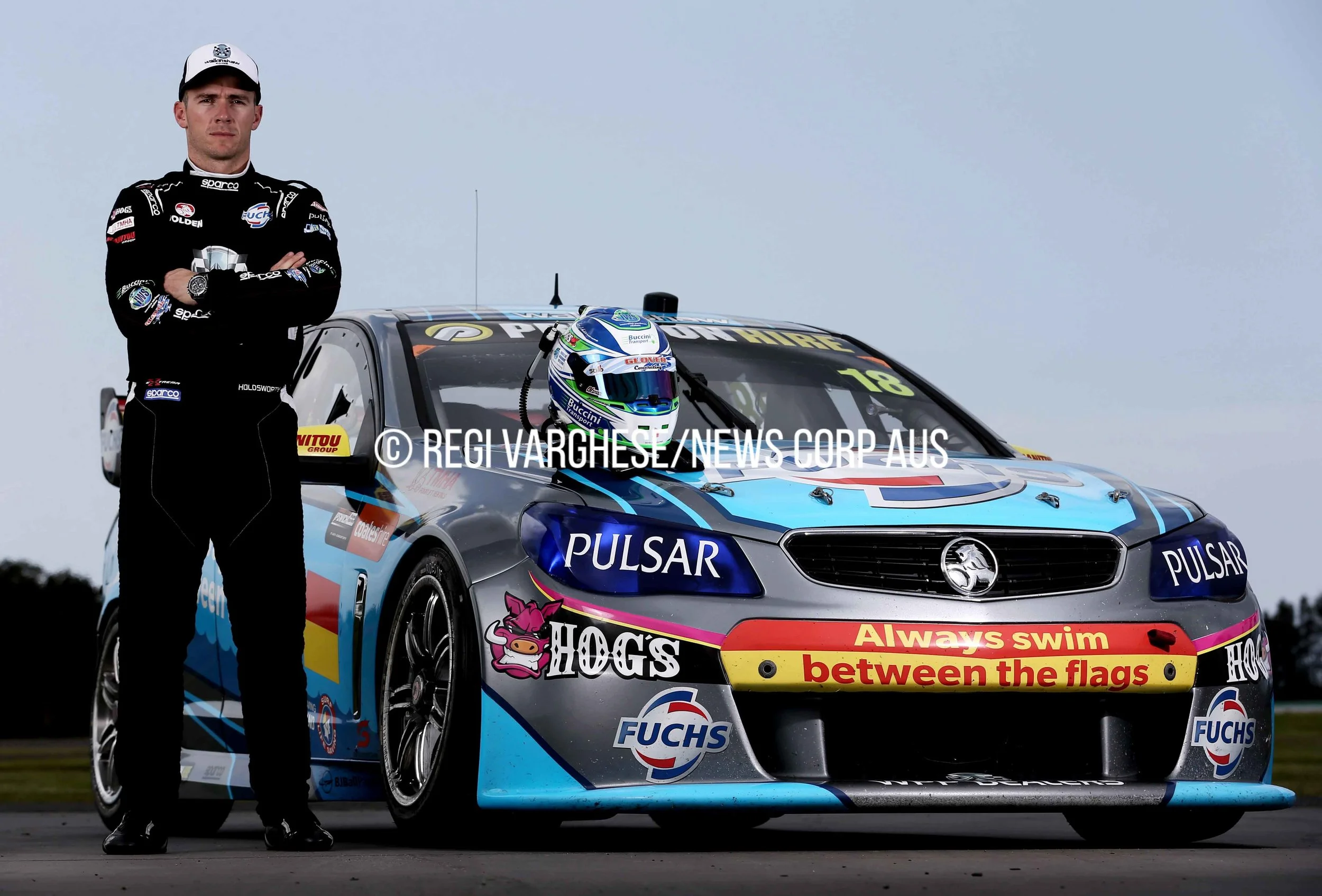 CHP_Export_123122804_V8 Supercar driver Lee Holdsworth beside his Walkinshaw Racing team Holden.jpg