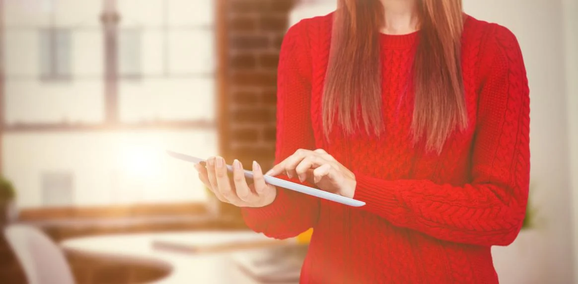 composite-image-of-mid-section-of-a-hipster-woman-using-her-tablet.jpg