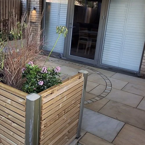 A collaboration between garden designer and landscaper to transform an unused yard into a cosy space.