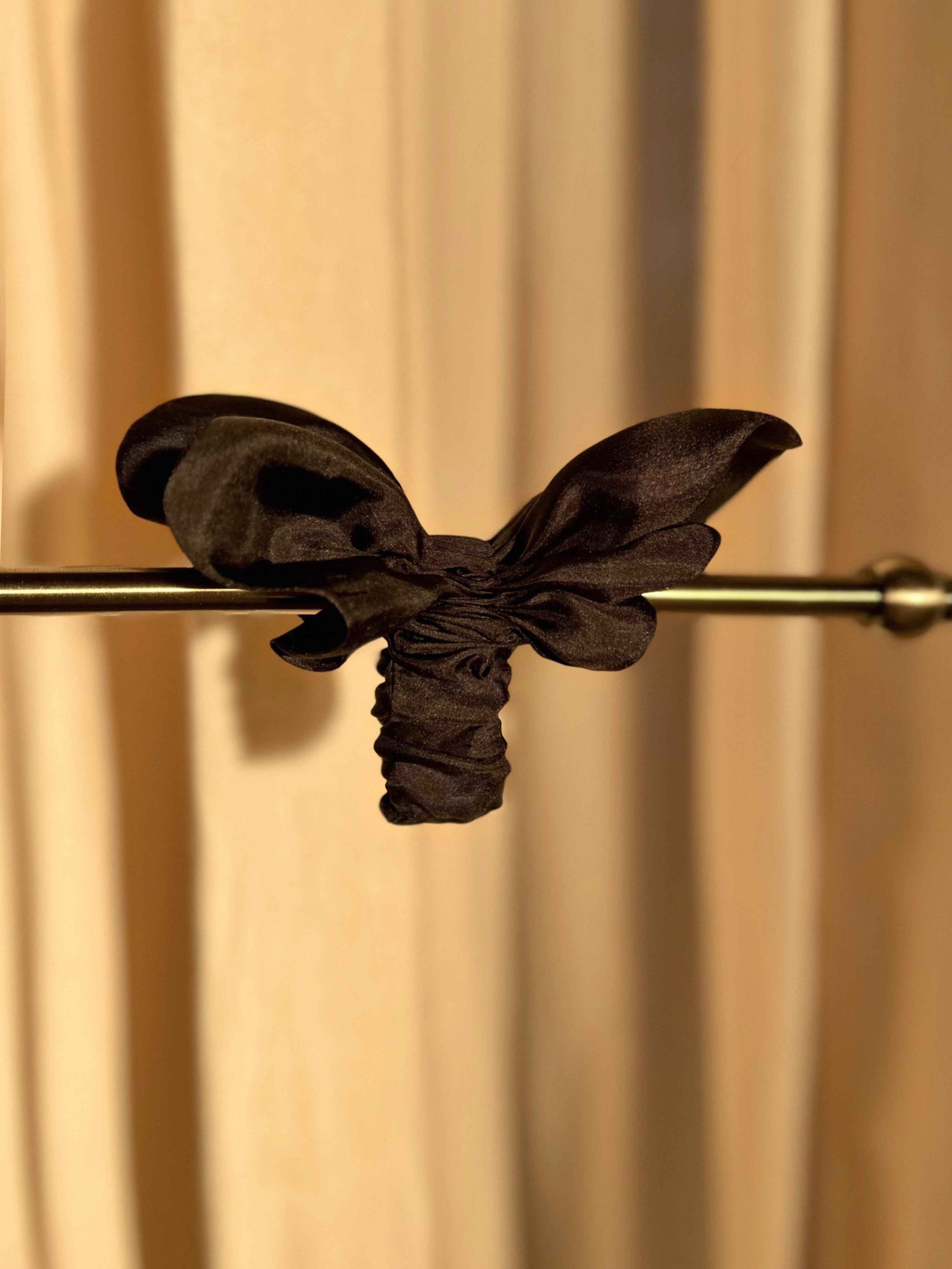 Double Ruffle Hair Accessory -black on stand.jpg